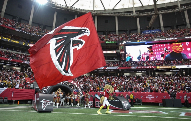 Dec 14, 2014; Atlanta, GA, USA; Atlanta Falcons mascot Freddie Falcon waves the Falcons flag before their game against the Pittsburgh Steelers at the Georgia Dome. The Steelers won 27-20. Mandatory Credit: Jason Getz-USA TODAY Sports